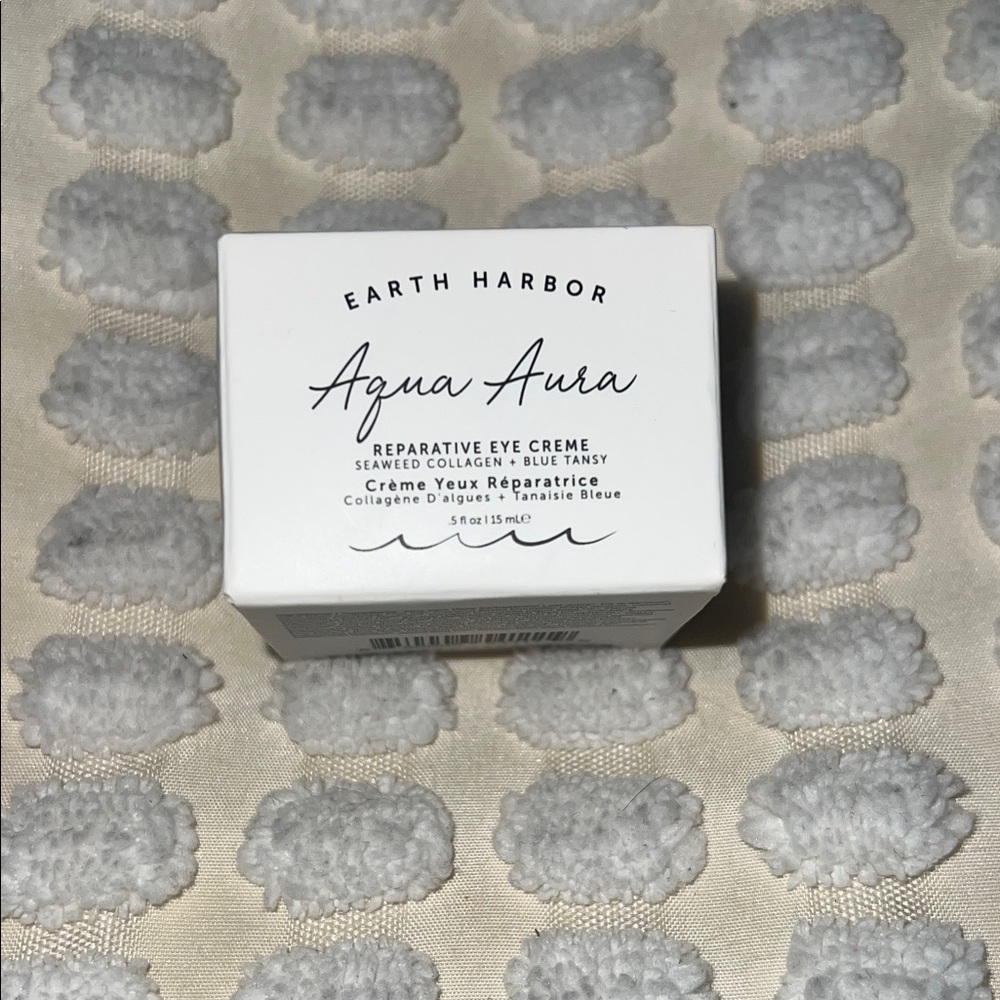 Earth Aqua Aura Eye Creme in White and Blue